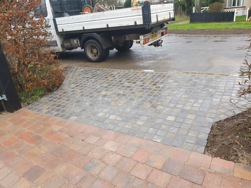 Green Room Gardens - block paving driveway in progress with herringbone pattern