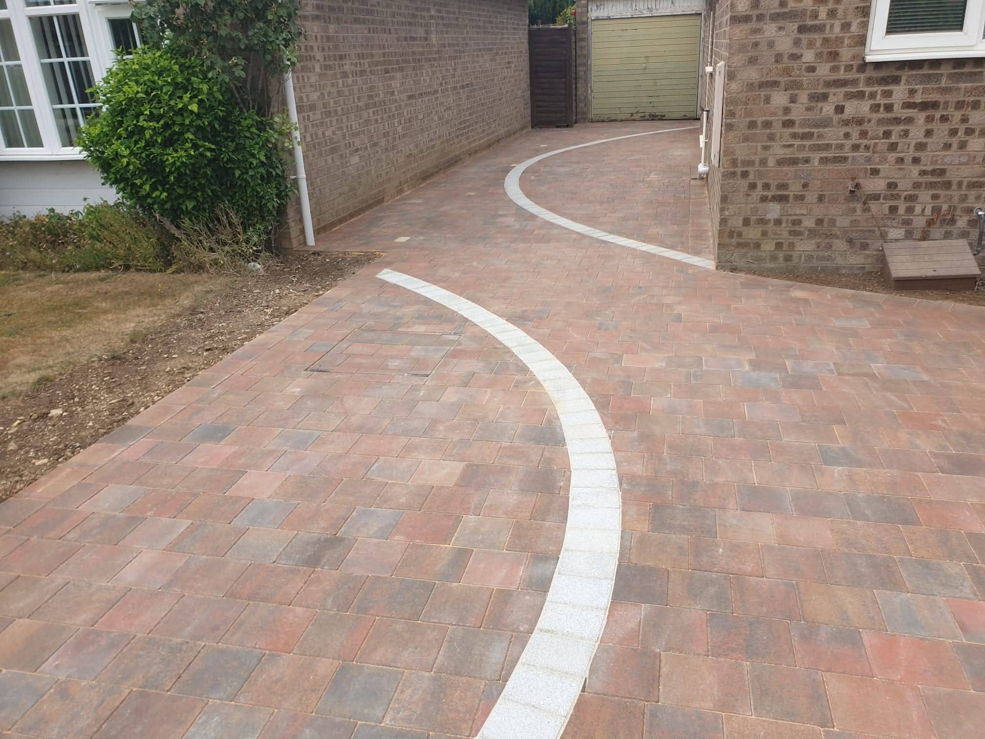Green Room Gardens - block paving driveway with curved white border detail